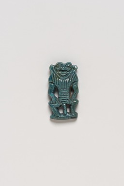  <em>Male Birth-God</em>, ca. 1539-1425 B.C.E. Faience, 1 1/4 x 11/16 x 3/16 in. (3.1 x 1.7 x 0.5 cm). Brooklyn Museum, Charles Edwin Wilbour Fund, 37.912E. Creative Commons-BY (Photo: Brooklyn Museum, 37.912E_top_PS20.jpg)