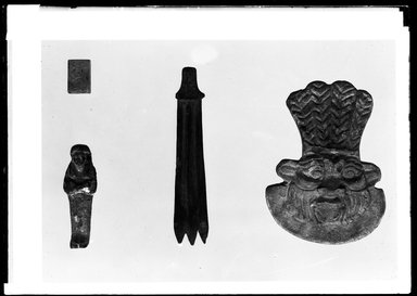  <em>Ceremonial Fly Flap from a Statue of Osiris</em>. Wood, Length: 3 in. (7.6 cm). Brooklyn Museum, Charles Edwin Wilbour Fund, 37.1056E. Creative Commons-BY (Photo: , 37.919E_37.1056E_37.1160E_37.1337E_GrpA_SL4.jpg)