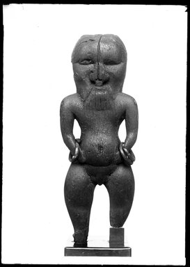  <em>Figure of Bes with Bracelets</em>, ca. 1539-1075 B.C.E. Wood (ebony?), bronze, 5 1/2 × 2 1/16 × 1 3/16 in. (14 × 5.3 × 3 cm). Brooklyn Museum, Charles Edwin Wilbour Fund, 37.920E. Creative Commons-BY (Photo: Brooklyn Museum, 37.920E_NegA_SL4.jpg)