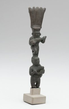  <em>Bes with Lute</em>, 664-343 B.C.E. Copper alloy, 4 1/2 × 1 1/16 × 7/8 in. (11.4 × 2.7 × 2.3 cm). Brooklyn Museum, Charles Edwin Wilbour Fund, 37.921E. Creative Commons-BY (Photo: Brooklyn Museum, 37.921E_front_PS2.jpg)
