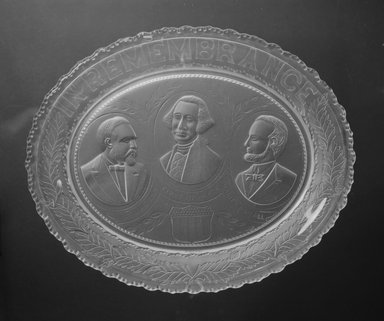  <em>Plate (George Washington, James Garfield, & Abraham Lincoln)</em>, 1881. Glass, 1 3/8 x 12 1/2 x 10 in. (3.5 x 31.8 x 25.4 cm). Brooklyn Museum, Gift of Mrs. William Greig Walker by subscription, 40.154. Creative Commons-BY (Photo: Brooklyn Museum, 40.154_bw.jpg)