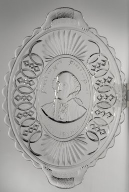  <em>Platter (George Washington)</em>, ca. 1876. Glass, 1 1/2 x 8 1/2 x 12 in. (3.8 x 21.6 x 30.5 cm). Brooklyn Museum, Gift of Mrs. William Greig Walker by subscription, 40.164. Creative Commons-BY (Photo: Brooklyn Museum, 40.164.jpg)