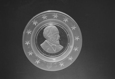  <em>Plate (James Garfield)</em>, ca. 1881. Glass, 1 x 6 x 6 in. (2.5 x 15.2 x 15.2 cm). Brooklyn Museum, Gift of Mrs. William Greig Walker by subscription, 40.168. Creative Commons-BY (Photo: Brooklyn Museum, 40.168_bw.jpg)