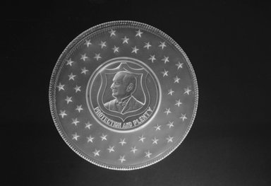  <em>Plate (William McKinley)</em>, ca. 1896. Glass, 1 x 7 1/4 x 7 1/4 in. (2.5 x 18.4 x 18.4 cm). Brooklyn Museum, Gift of Mrs. William Greig Walker by subscription, 40.173. Creative Commons-BY (Photo: Brooklyn Museum, 40.173_acetate_bw.jpg)