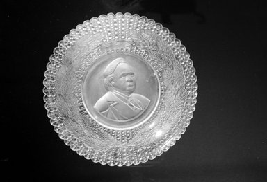  <em>Plate (Henry Ward Beecher)</em>, ca. 1887. Glass, 1 3/8 x 9 1/4 x 9 1/4 in. (3.5 x 23.5 x 23.5 cm). Brooklyn Museum, Gift of Mrs. William Greig Walker by subscription, 40.186. Creative Commons-BY (Photo: Brooklyn Museum, 40.186_bw.jpg)