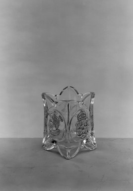  <em>Toothpick Holder (Amerigo Vespucci & Christopher Columbus)</em>, ca. 1892. Glass, 2 7/8 x 2 x 2 in. (7.3 x 5.1 x 5.1 cm). Brooklyn Museum, Gift of Mrs. William Greig Walker by subscription, 40.189. Creative Commons-BY (Photo: Brooklyn Museum, 40.189_acetate_bw.jpg)