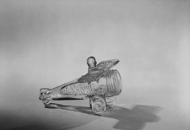 American. <em>Goodwill Plane with Charles Lindberg</em>, 1928. Glass, Length: 4 3/8 in. (11.1 cm); Width: 3 7/8 in. (9.8 cm). Brooklyn Museum, Gift of Mrs. William Greig Walker by subscription, 40.190. Creative Commons-BY (Photo: Brooklyn Museum, 40.190_bw.jpg)
