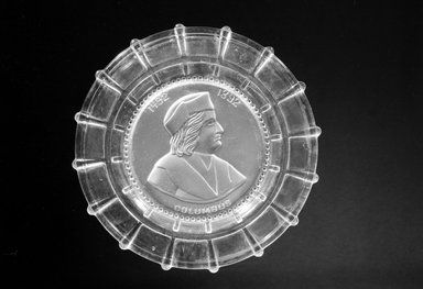  <em>Plate (Christopher Columbus)</em>, ca. 1892. Glass, 7/8 x 9 3/8 x 9 3/8 in. (2.2 x 23.8 x 23.8 cm). Brooklyn Museum, Gift of Mrs. William Greig Walker by subscription, 40.195. Creative Commons-BY (Photo: Brooklyn Museum, 40.195_bw.jpg)