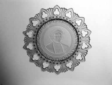  <em>Plate (Christopher Columbus)</em>, ca. 1892. Glass, 1 1/4 x 9 3/4 x 9 3/4 in. (3.2 x 24.8 x 24.8 cm). Brooklyn Museum, Gift of Mrs. William Greig Walker by subscription, 40.196. Creative Commons-BY (Photo: Brooklyn Museum, 40.196_bw.jpg)