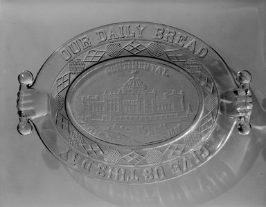 American. <em>Bread Plate (Continental Hall)</em>, 1876. Glass, 2 1/8 x 12 7/8 x 9 in. (5.4 x 32.7 x 22.9 cm). Brooklyn Museum, Gift of Mrs. William Greig Walker by subscription, 40.212. Creative Commons-BY (Photo: Brooklyn Museum, 40.212_bw.jpg)
