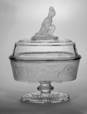 James Gillinder & Sons (American, 1860-1930s). <em>Compote, "Westward Ho!" Pattern</em>, ca. 1880. Glass, 11 1/2 x 8 3/4 x 5 1/2 in. (29.2 x 22.2 x 14 cm). Brooklyn Museum, Gift of Mrs. William Greig Walker by subscription, 40.226.1a-b. Creative Commons-BY (Photo: Brooklyn Museum, 40.226.1a-b_bw.jpg)