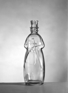 American. <em>Bottle, Figure of Carrie Nation</em>, late 19th century. Glass, 9 x 3 1/4 x 3 in. (22.9 x 8.3 x 7.6 cm). Brooklyn Museum, Gift of Mrs. William Greig Walker by subscription, 40.281. Creative Commons-BY (Photo: Brooklyn Museum, 40.281_acetate_bw.jpg)