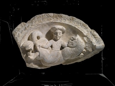 Coptic. <em>Top of an Arch with a Nymph Riding a Sea Monster</em>, 5th-6th century C.E. Limestone, pigment, 18 1/8 x 31 1/8 x 14 3/8 in. (46 x 79 x 36.5 cm). Brooklyn Museum, Charles Edwin Wilbour Fund, 41.1226. Creative Commons-BY (Photo: Brooklyn Museum, 41.1226_PS2.jpg)