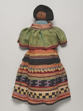 Seminole. <em>Doll Wearing Seminole Woman's Outfit</em>, ca. 1940. Cotton, palmetto fiber, silk, beads, paper, 20 1/2 × 11 × 5 3/16 in. (52.1 × 27.9 × 13.2 cm). Brooklyn Museum, A. Augustus Healy Fund, 41.222. Creative Commons-BY (Photo: , 41.222_PS9.jpg)