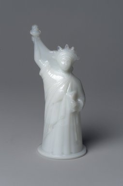 American. <em>Figure,  Statue of Liberty</em>, late 19th century. Glass, Overall: 6 x 2 3/4 x 2 3/8 in. (15.2 x 7 x 6 cm). Brooklyn Museum, Gift of Robert J. Kuhn, 41.697. Creative Commons-BY (Photo: Brooklyn Museum, 41.697.jpg)