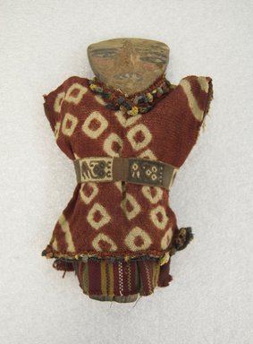  <em>Doll</em>. Ceramic, cotton?, camelid fiber?, pigment, 9 1/16 x 4 5/16 x 1 9/16 in. (23 x 11 x 4 cm). Brooklyn Museum, A. Augutus Healy Fund, 42.150. Creative Commons-BY (Photo: Brooklyn Museum, 42.150_front_PS5.jpg)