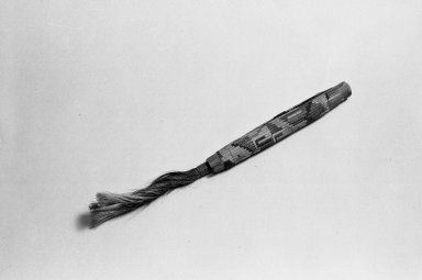 Possibly Nazca. <em>Needle Case</em>, 100-600. Wood, reeds, cotton? fiber, camelid? fiber, plant fiber, 1 1/4 x 7/8 x 12 1/4 in. (3.2 x 2.2 x 31.1 cm). Brooklyn Museum, A. Augustus Healy Fund, 42.151. Creative Commons-BY (Photo: Brooklyn Museum, 42.151_acetate_bw.jpg)