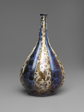  <em>Lobed Bottle with Simurghs (Phoenixes) in Flight</em>, 17th century. Ceramic; fritware, painted in luster on opaque white and cobalt blue glazes, 13 x 7 1/16 in. (33 x 18 cm). Brooklyn Museum, Gift of Mrs. Horace O. Havemeyer, 42.212.16. Creative Commons-BY (Photo: Brooklyn Museum, 42.212.16_front_PS2.jpg)
