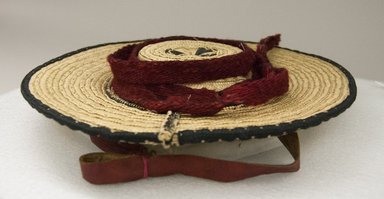  <em>Man's Hat</em>, first half 20th century. Straw, textile material, 1 3/4 x 12 3/16 x 12 3/16 in. (4.5 x 31 x 31 cm). Brooklyn Museum, Museum Expedition 1942, Frank L. Babbott Fund, 42.235.28. Creative Commons-BY (Photo: Brooklyn Museum, 42.235.28_front_PS5.jpg)