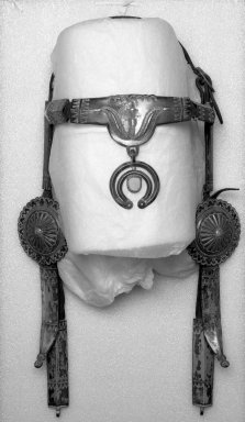 Navajo. <em>Bridle with Conches</em>, late 19th or early 20th century. Hide, iron, silver, turquoise, 21 x 12 1/2 x 7 in. (53.3 x 31.8 x 17.8 cm). Brooklyn Museum, Anonymous gift in memory of Dr. Harlow Brooks, 43.201.139. Creative Commons-BY (Photo: Brooklyn Museum, 43.201.139_bw.jpg)