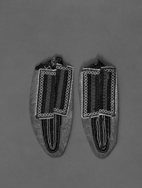 Great Lakes (unidentified). <em>Pair of Moccasins</em>, 20th century. Hide, bead, silk, 8 11/16 x 3 9/16 in.  (22.0 x 9.0 cm). Brooklyn Museum, Anonymous gift in memory of Dr. Harlow Brooks, 43.201.65a-b. Creative Commons-BY (Photo: Brooklyn Museum, 43.201.65a-b_bw.jpg)