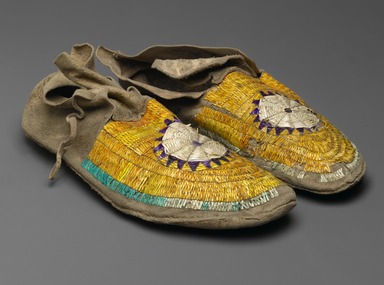 Sioux. <em>Pair of Moccasins</em>, ca. 1882. Hide, porcupine twill, 10 7/16 x 3 15/16 in. (26.5 x 10 cm). Brooklyn Museum, Anonymous gift in memory of Dr. Harlow Brooks, 43.201.66a-b. Creative Commons-BY (Photo: Brooklyn Museum, 43.201.66a-b_view2_PS2.jpg)