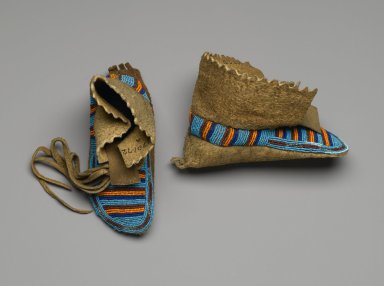 Interior Salish. <em>Pair of Child's Moccasins</em>, 1885-1895. Smoked hide, beads, cut steel beads, 7 1/2 x 3 1/8 in. (19.1 x 7.9 cm). Brooklyn Museum, Anonymous gift in memory of Dr. Harlow Brooks, 43.201.72a-b. Creative Commons-BY (Photo: Brooklyn Museum, 43.201.72a-b_PS2.jpg)