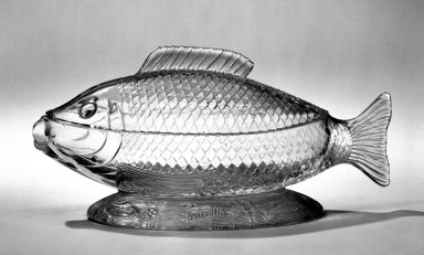 American. <em>Fish Dish</em>, circa 1875. Pressed glass, 4 3/4 × 9 3/4 in. (12.1 × 24.8 cm). Brooklyn Museum, Gift of Mrs. Edwin P. Maynard, 44.32.9a-b. Creative Commons-BY (Photo: Brooklyn Museum, 44.32.9a-b_bw.jpg)