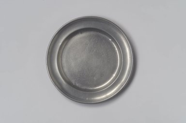 Spencer Stafford. <em>Plate</em>, ca. 1820–1830. Pewter, 5/8 x 8 x 8 in. (1.6 x 20.3 x 20.3 cm). Brooklyn Museum, Gift of Arthur W. Clement, 45.1.2. Creative Commons-BY (Photo: Brooklyn Museum, 45.1.2.jpg)