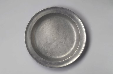 Jacob Eggleston. <em>Plate</em>, 1795–1813. Pewter, 1 1/2 x 13 1/4 x 13 1/4 in. (3.8 x 33.7 x 33.7 cm). Brooklyn Museum, Gift of Arthur W. Clement, 45.1.31. Creative Commons-BY (Photo: Brooklyn Museum, 45.1.31.jpg)