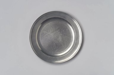 Thomas Badger, Jr.. <em>Plate</em>, 1787–1818. Pewter, 1/2 x 7 7/8 x 7 7/8 in. (1.3 x 20 x 20 cm). Brooklyn Museum, Designated Purchase Fund, 45.10.1. Creative Commons-BY (Photo: Brooklyn Museum, 45.10.1.jpg)