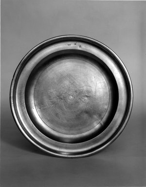 Nathaniel Austin. <em>Plate</em>, 1763–1807. Pewter, 5/8 x 8 3/4 x 8 3/4 in. (1.6 x 22.2 x 22.2 cm). Brooklyn Museum, Designated Purchase Fund, 45.10.11. Creative Commons-BY (Photo: Brooklyn Museum, 45.10.11_bw.jpg)