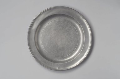 Henry Will. <em>Large Plate or Platter</em>, 1761–1793. Pewter, 1 x 13 1/8 x 13 1/8 in. (2.5 x 33.3 x 33.3 cm). Brooklyn Museum, Designated Purchase Fund, 45.10.169. Creative Commons-BY (Photo: Brooklyn Museum, 45.10.169.jpg)