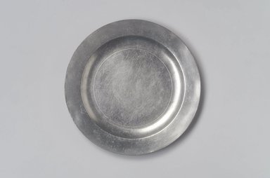 Possibly Thomas Byles (1738–1771). <em>Plate</em>, 18th century. Pewter, 5/8 x 8 1/2 x 8 1/2 in. (1.6 x 21.6 x 21.6 cm). Brooklyn Museum, Designated Purchase Fund, 45.10.241. Creative Commons-BY (Photo: Brooklyn Museum, 45.10.241.jpg)