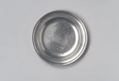 John Danforth. <em>Plate</em>, 1773-1793. Pewter, 3/4 x 7 5/8 x 7 5/8 in. (1.9 x 19.4 x 19.4 cm). Brooklyn Museum, Designated Purchase Fund, 45.10.64. Creative Commons-BY (Photo: Brooklyn Museum, 45.10.64.jpg)