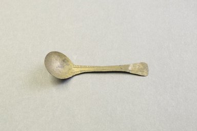 Akan. <em>Spoon for Gold Dust</em>, late 19th-early 20th century. Copper alloy, 7/8 x 3 1/16 in. (2.3 x 7.8 cm). Brooklyn Museum, Carll H. de Silver Fund, 45.11.9. Creative Commons-BY (Photo: Brooklyn Museum, 45.11.9_front_PS5.jpg)