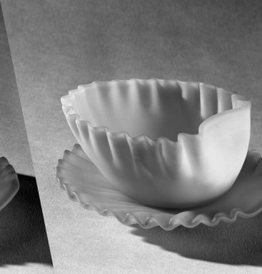 American. <em>Cup and Saucer</em>, late 19th century. Glass, Diam of saucer: 4 1/4 in. (10.8 cm). Brooklyn Museum, Dick S. Ramsay Fund, 45.143.25a-b. Creative Commons-BY (Photo: Brooklyn Museum, 45.143.25a-b_acetate_bw.jpg)