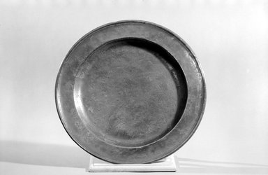 William Will. <em>Platter</em>, 1764–1798. Pewter, 1 1/8 x 16 5/8 x 16 5/8 in. (2.9 x 42.2 x 42.2 cm). Brooklyn Museum, Dick S. Ramsay Fund, 45.48. Creative Commons-BY (Photo: Brooklyn Museum, 45.48_bw.jpg)