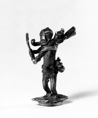 Akan. <em>Gold-weight (abrammuo): male figure</em>. Brass, 1 1/2 x 11/16 x 1/2 in. (3.8 x 1.8 x 1.2 cm). Brooklyn Museum, Charles Stewart Smith Memorial Fund, 46.95.1. Creative Commons-BY (Photo: Brooklyn Museum, 46.95.1_bw.jpg)