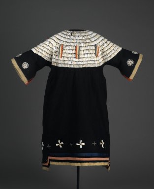 Possibly Sioux. <em>Dress</em>, 1875-1900. Wool cloth, dentalium shells, ribbon, glass beads, brass bells, cotton, 43 5/16 x 33 7/16in. (110 x 85cm). Brooklyn Museum, Charles Stewart Smith Memorial Fund, 46.96.12. Creative Commons-BY (Photo: Brooklyn Museum, 46.96.12_front_PS2.jpg)