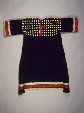 Sioux. <em>Dress</em>, late 19th–early 20th century. Wool cloth, elk  teeth,(or teeth carved from horn) silk ribbon, brass and tin sequins, 49 5/8 x 36 1/4 in. (126 x 92.1 cm). Brooklyn Museum, Charles Stewart Smith Memorial Fund, 46.96.13. Creative Commons-BY (Photo: Brooklyn Museum, 46.96.13.jpg)