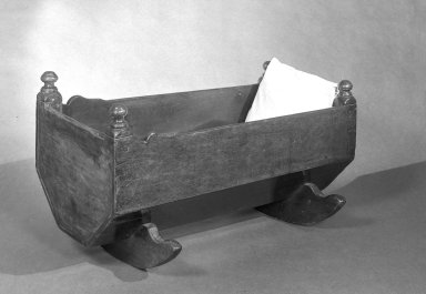  <em>Cradle</em>, early 18th century. Pine and maple wood, 18 1/4 x 34 x 17 1/2 in. (46.4 x 86.3 x 44.4 cm). Brooklyn Museum, Gift of Grace Kouwenhoven, 47.150. Creative Commons-BY (Photo: Brooklyn Museum, 47.150_view1_acetate_bw.jpg)