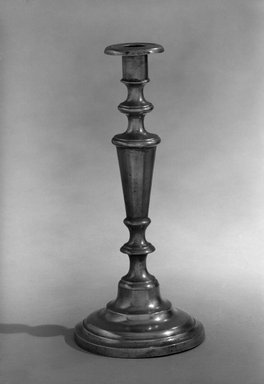 Taunton Britannia Manufacturing Co.. <em>Candlestick one of a pair</em>, 1830-1835. Pewter, 12 1/8 x 5 3/8 x 5 3/8 in. (30.8 x 13.7 x 13.7 cm). Brooklyn Museum, Dick S. Ramsay Fund, 47.179.1. Creative Commons-BY (Photo: Brooklyn Museum, 47.179.1_bw.jpg)