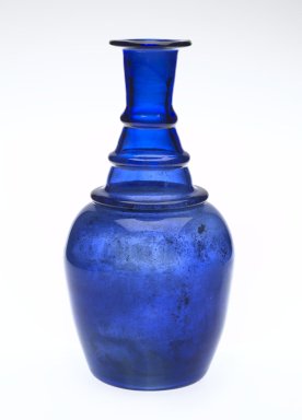  <em>Bottle</em>, 19th century. Translucent deep blue glass; free blown; tooled on the pontil, 7 7/8 x 3 15/16 in. (20 x 10 cm). Brooklyn Museum, Henry L. Batterman Fund, 47.203.10. Creative Commons-BY (Photo: Brooklyn Museum, 47.203.10_PS2.jpg)