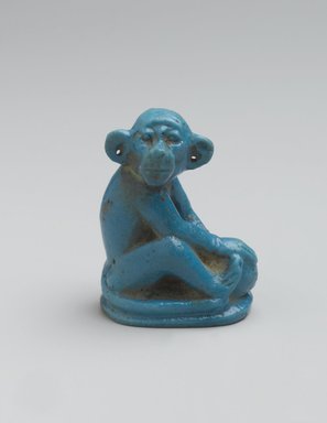  <em>Figure of Monkey Seated on Ovoid Base</em>, ca. 1352-1336 B.C.E. Faience, 2 1/8 × 1 1/8 × 1 9/16 in. (5.4 × 2.8 × 4 cm). Brooklyn Museum, Charles Edwin Wilbour Fund, 48.181. Creative Commons-BY (Photo: Brooklyn Museum, 48.181_PS2.jpg)