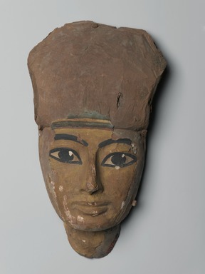 <em>Face from a Coffin</em>, ca. 1075–656 B.C.E. Wood, gesso, pigment, 6 1/16 x 3 1/8 x 10 7/16 in. (15.4 x 7.9 x 26.5 cm). Brooklyn Museum, Gift of Mrs. Lawrence Coolidge and Mrs. Robert Woods Bliss, and the Charles Edwin Wilbour Fund, 48.66.71. Creative Commons-BY (Photo: Brooklyn Museum, 48.66.71_front_PS2.jpg)
