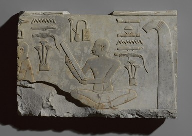 Egyptian. <em>Scribe and Official</em>, ca. 670–650 B.C.E. Limestone, pigment (Egyptian blue, indigo), 7 1/4 × 1 1/2 × 10 1/2 in., 5.5 lb. (18.4 × 3.8 × 26.7 cm, 2.49kg). Brooklyn Museum, Charles Edwin Wilbour Fund, 49.18. Creative Commons-BY (Photo: , 49.18_PS9.jpg)