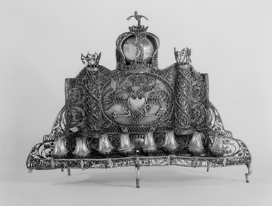  <em>Hanukkah Menorah</em>, ca. 1830–1850. Silver, 9 1/2 x 12 1/8 x 3 1/2 in. (24.1 x 30.8 x 8.9 cm). Brooklyn Museum, Purchased with funds given by Fred Zeitz, 49.228.14. Creative Commons-BY (Photo: Brooklyn Museum, 49.228.14_bw.jpg)