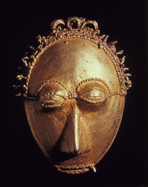 Baule. <em>Pendant Mask</em>, 19th or 20th century. Gold cast by the lost wax process., 2 3/8 x 1 3/4 x 1 in. (6 x 4.5 x 2.5 cm). Brooklyn Museum, A. Augustus Healy Fund, 49.32.1. Creative Commons-BY (Photo: Brooklyn Museum, 49.32.1_reference_SL1.jpg)