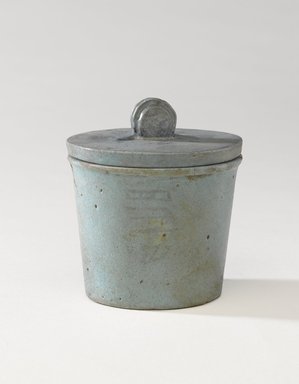  <em>One of a Set of Jars for Seven Sacred Oils or Unguents</em>, 305–30 B.C.E. Faience, 2 1/2 x 2 3/8 in. (6.4 x 6 cm). Brooklyn Museum, Charles Edwin Wilbour Fund, 49.52.2a-b. Creative Commons-BY (Photo: Brooklyn Museum, 49.52.2a-b_PS9.jpg)